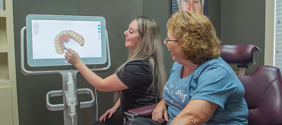 assistant showing the machine for cerec