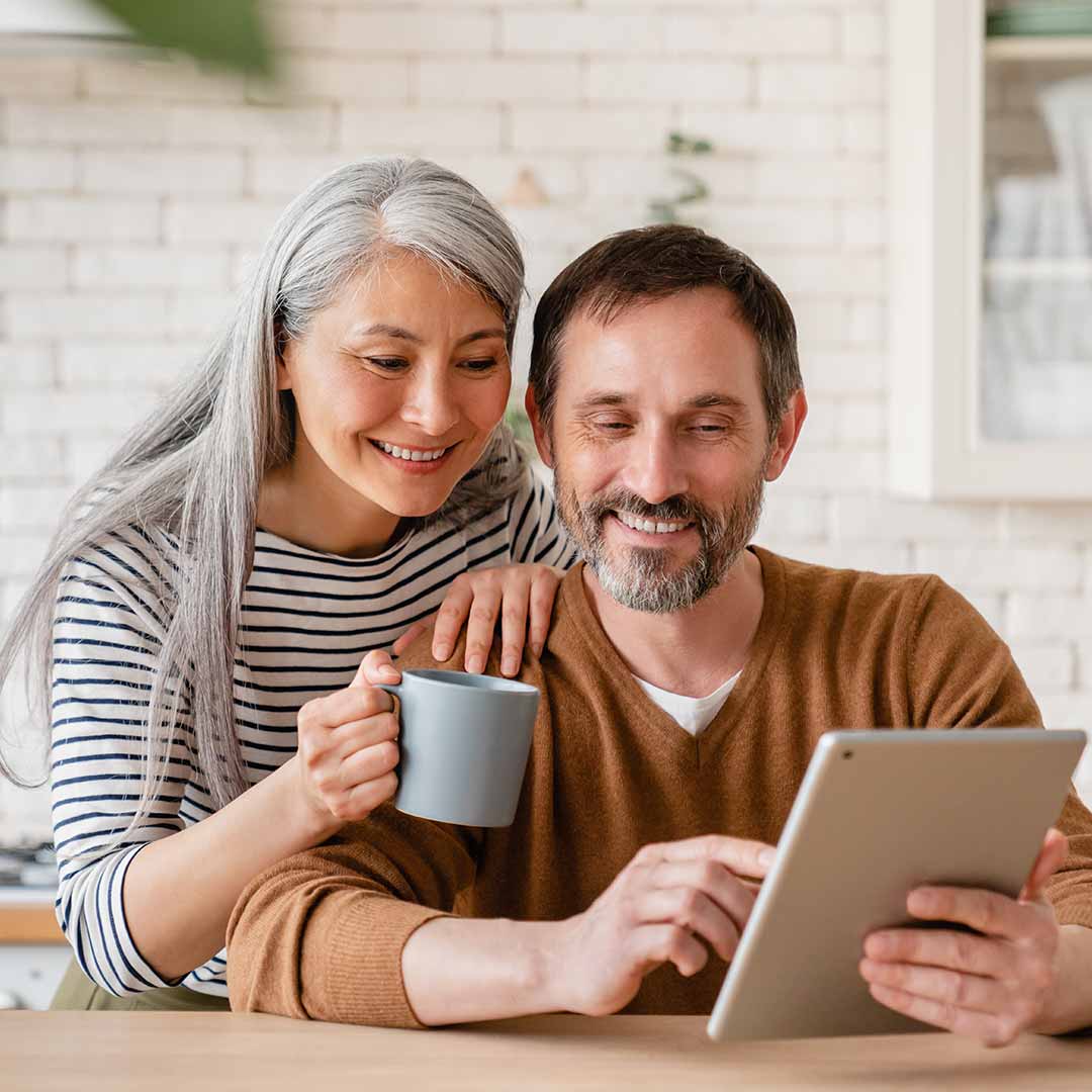 couple looking at ipad