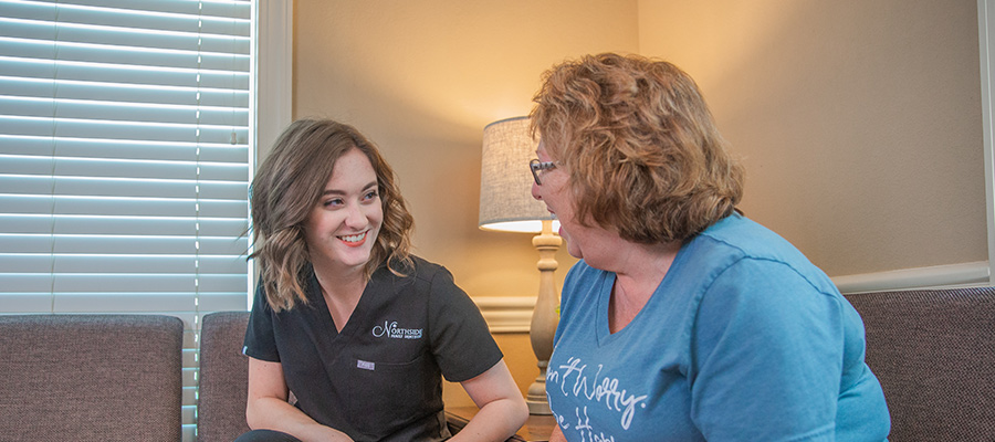 staff talking to patient